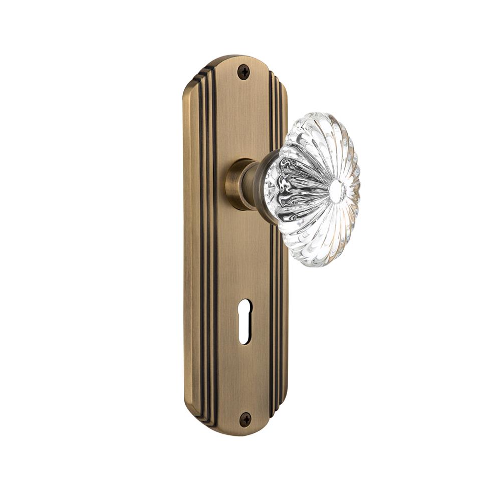 Nostalgic Warehouse DECOFC Complete Mortise Lockset Deco Plate with Oval Fluted Crystal Knob in Antique Brass